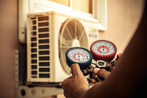 Professional Air Conditioning Service technician working in Reston, VA